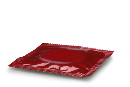 Red condom isolated on white, Clipping Path